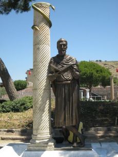 <p>A modern statue of Asclepius from the Asclepium in Pergamos. Notice the snake, which was a symbol associated with Asclepius. This symbol continues to represent medical fields today (photo by Joel Meeker).</p>