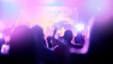 Colorful fuzzy photo of a modern evangelical worship service to illustrate the article 