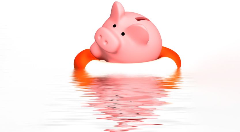 Illustration of a piggy bank in a life saver ring on the water, to represent the article How to Deal With Financial Problems