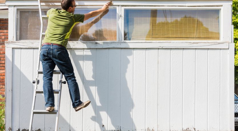 Photo of a man leaning and reaching precariously from a ladder, to illustrate the article If Anyone Lacks Wisdom.