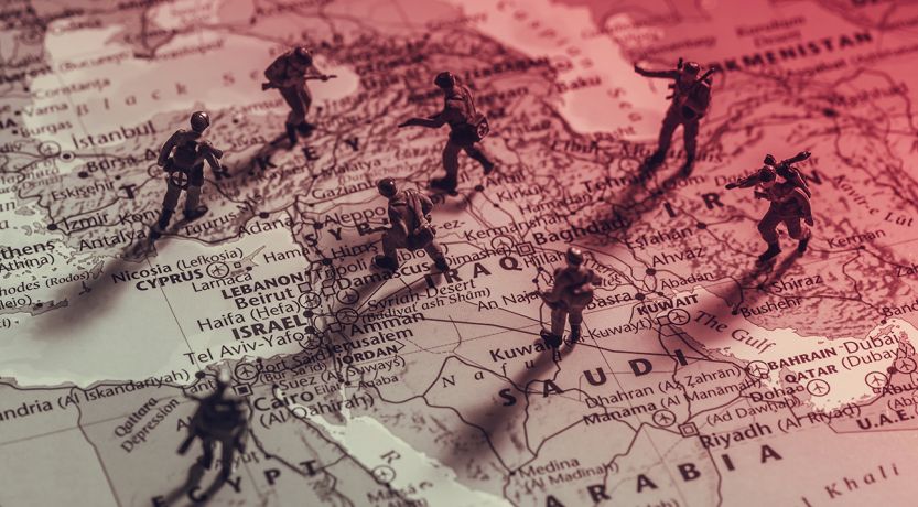 Image of toy soldiers on a map of the Middle East, to illustrate the article Middle East Justice?