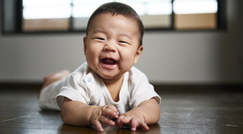 Photo of a baby laughing to illustrate the article Purity in the Bible.