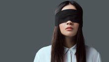 Photo of a blindfolded girl to illustrate the article Spiritual Blindness and Spiritual Veils.