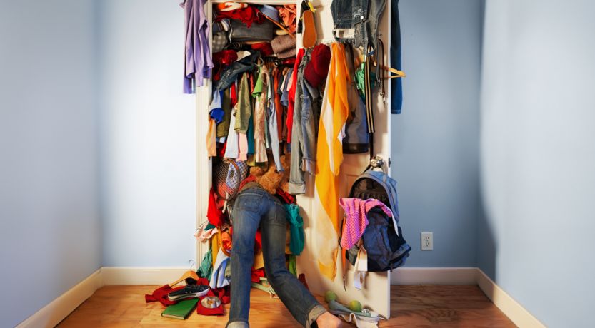 Photo of an overflowing closet to illustrate the article Spiritual Decluttering.