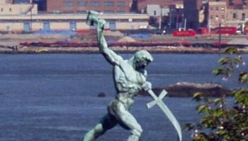 The Kingdom of God Is Real! Let Us Beat Swords into Plowshares, a sculpture by Evgeniy Vuchetich at the United Nations (Wikimedia Commons).