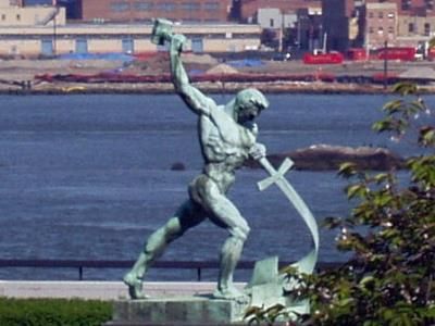 The Kingdom of God Is Real! Let Us Beat Swords into Plowshares, a sculpture by Evgeniy Vuchetich at the United Nations (Wikimedia Commons).