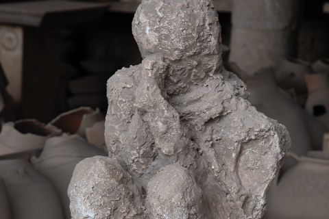 A photo of a cast made from a body found buried in Pompeii, to illustrate the article The Fate of Those Who Died in Pompeii