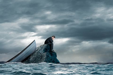 Illustration of a person stuck on a rock far out to sea, to represent the article 
