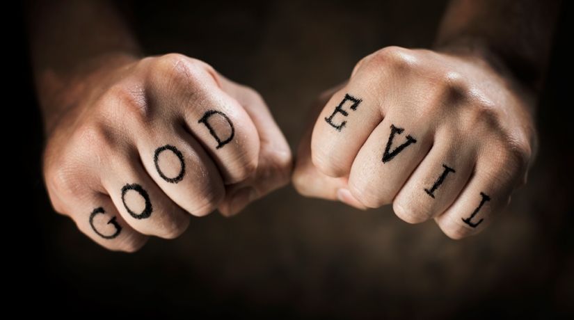 What Is Human Nature? (photo of fists with Good and Evil written on them)