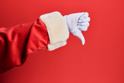 Photo of a red sleeve and white gloved hand giving a thumbs down to illustrate the article 