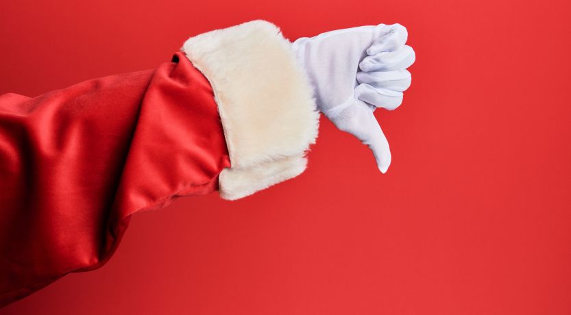 Photo of a red sleeve and white gloved hand giving a thumbs down to illustrate the article 