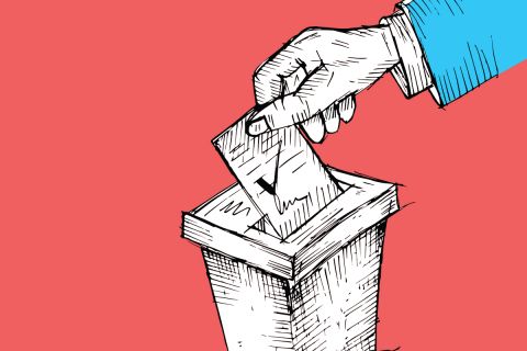 An illustration of a hand putting a ballot into a ballot box to illustrate the article Who Would Jesus Vote For?