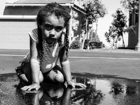 <p>A puddle is the new pool for a little girl in California.</p>