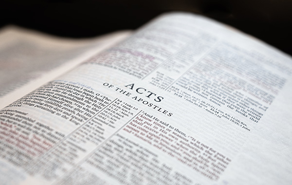 Open Bible showing the book of Acts