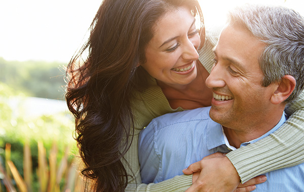 Couple embracing while looking at each other