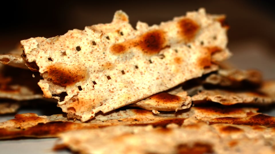 Photo of broken matzos (unleavened bread) to illustrate the article 