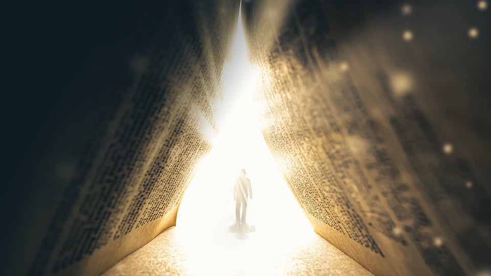 Illustration of a person entering a bright light, seen under an open Bible forming a tent, to illustrate the article 