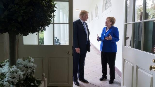 Photo of U.S. President Donald Trump with German Chancellor Angela Merkel to illustrate the 2018 article Transatlantic Turmoil Escalates
