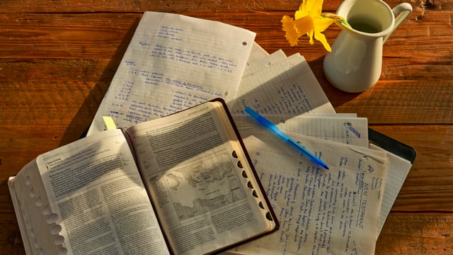 Photo of a Bible and study materials to illustrate the article Should You Try Inductive Bible Study?