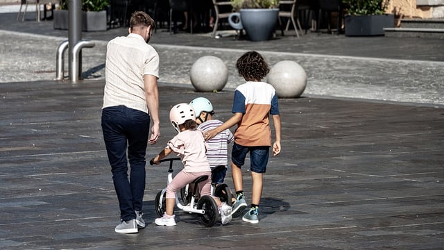 Photo of a father with kids