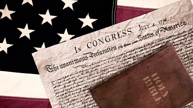 Photos of a U.S. flag, the Declaration of Independence and a Bible