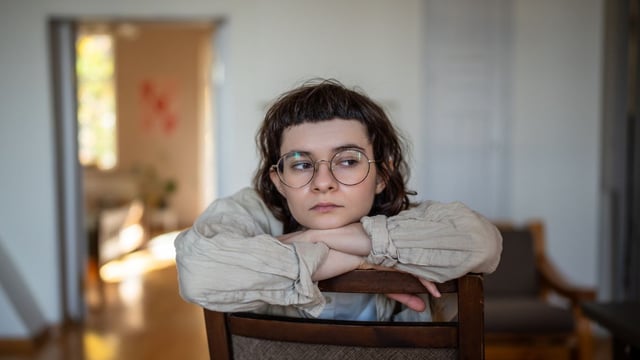 Photo of a person sitting pensively to illustrate the article Escaping Self-Destructive Attitudes 