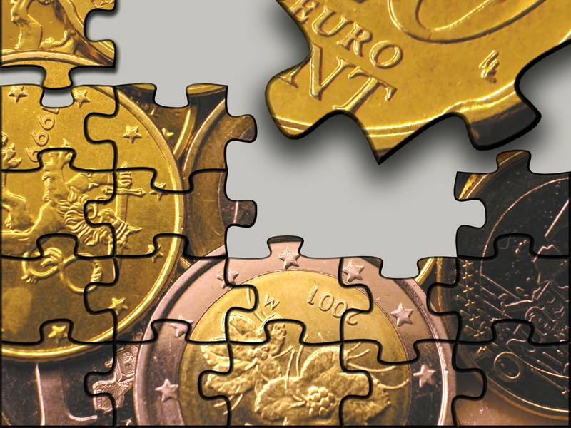 The future of Europe illustrated with a jigsaw puzzle of euro coins.